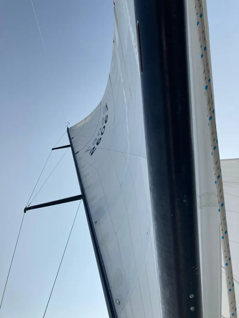 Slide: The Image of Sail of a 1977 Baltic 42 yacht against a clear blue sky. - 37