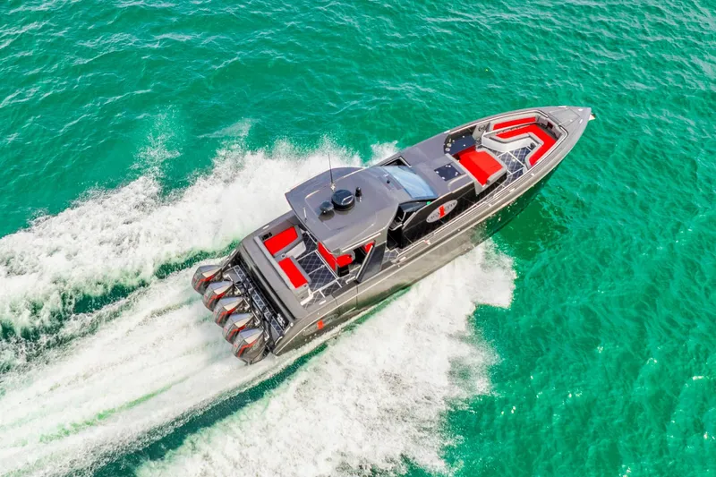 Slide: The Image of 2025 Cigarette 42 Nighteagle speedboat cruising on turquoise water. - 10