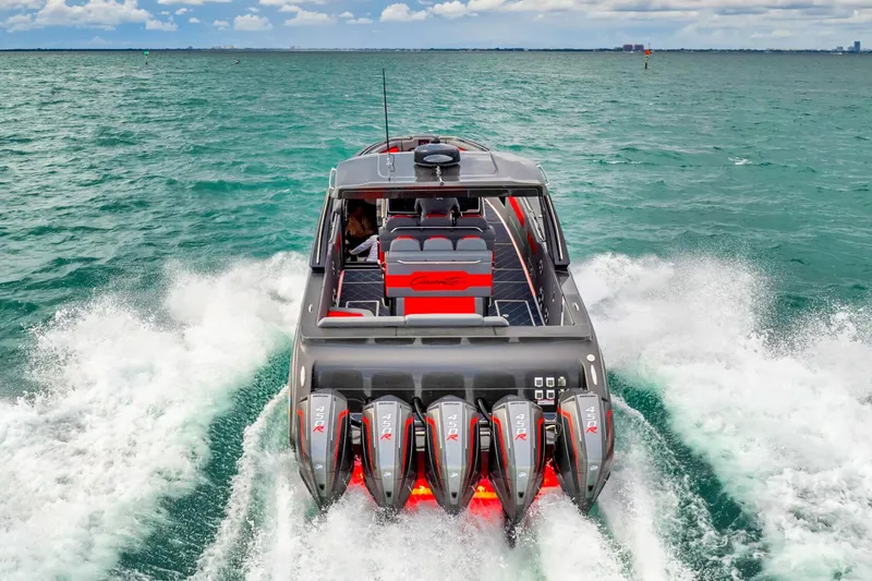 Slide: The Image of 2025 Cigarette 42 Nighteagle speedboat with multiple outboard engines cruising on open water. - 11