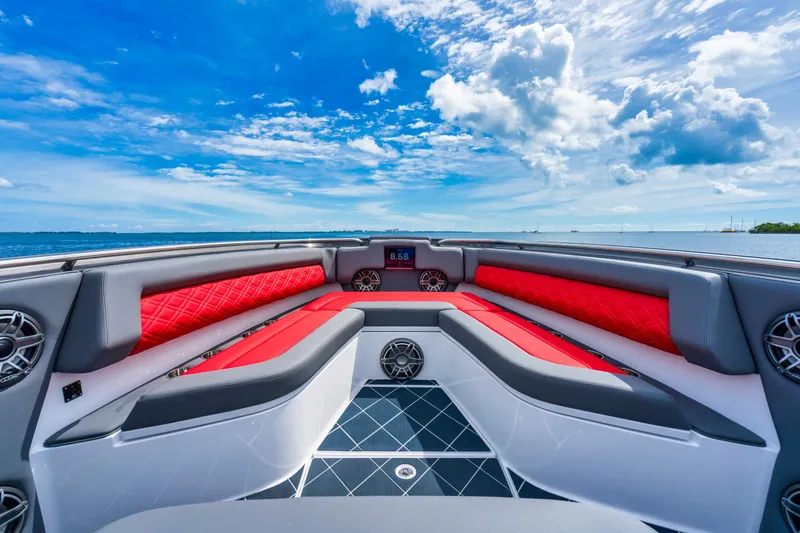 Slide: The Image of 2025 Cigarette 42 Nighteagle boat interior with red and gray seating, ocean view. - 14