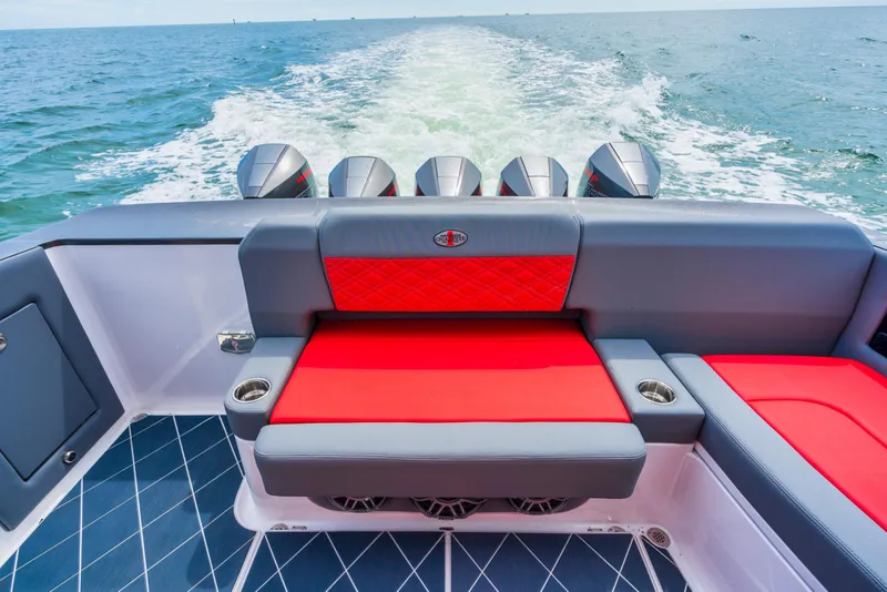 Slide: The Image of Red and gray seating on 2025 Cigarette 42 Nighteagle boat with ocean backdrop. - 15