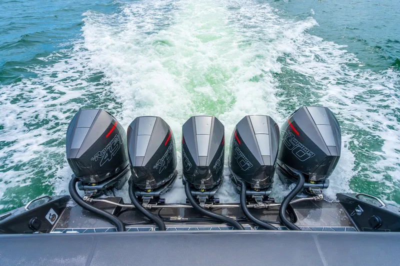 Slide: The Image of 2025 Cigarette 42 Nighteagle boat with four powerful outboard engines on water. - 17