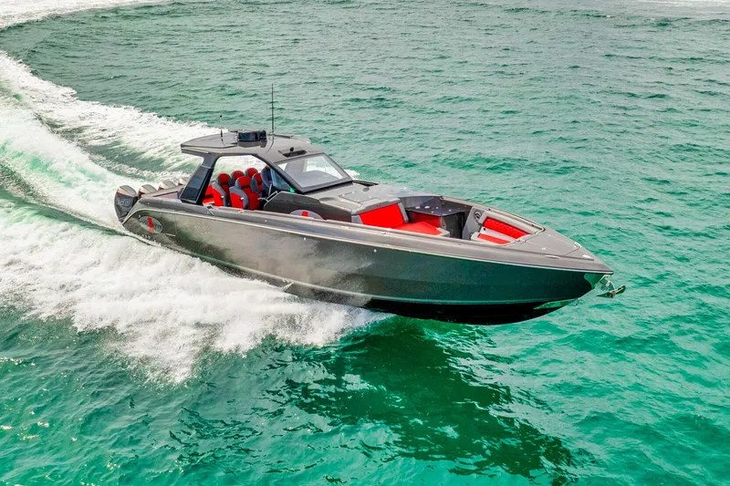 Slide: The Image of 2025 Cigarette 42 Nighteagle speedboat cruising on clear turquoise waters. - 6