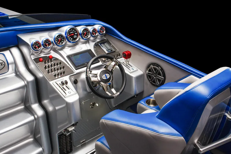Slide: The Image of 2025 Cigarette 38 Top Gun boat cockpit with advanced controls and blue accents - 12