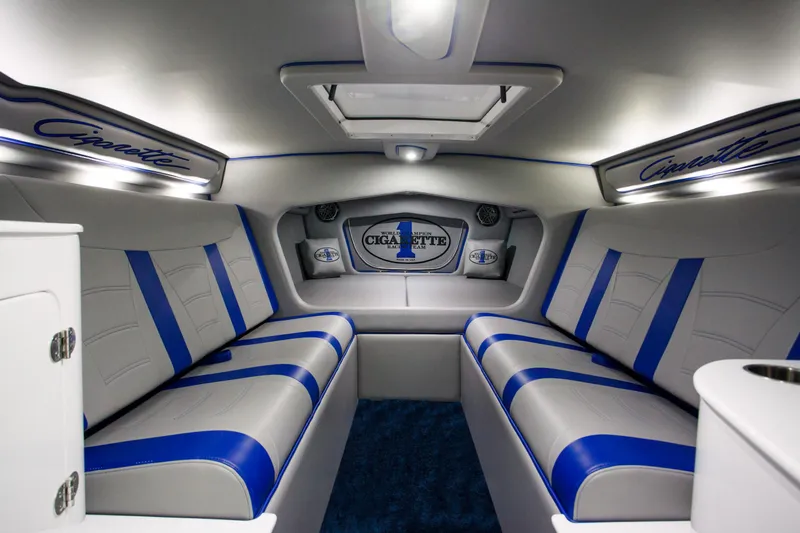 Slide: The Image of Interior of 2025 Cigarette 38 Top Gun boat with blue and white seating. - 13