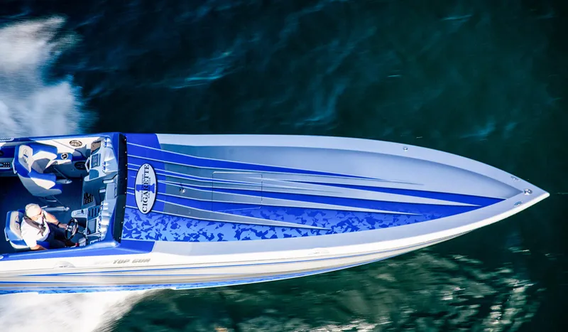 Slide: The Image of 2025 Cigarette 38 Top Gun speedboat cruising on water, aerial view. - 4