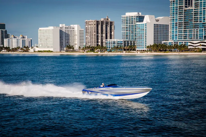 Slide: The Image of 2025 Cigarette 38 Top Gun speedboat cruising near city skyline. - 9