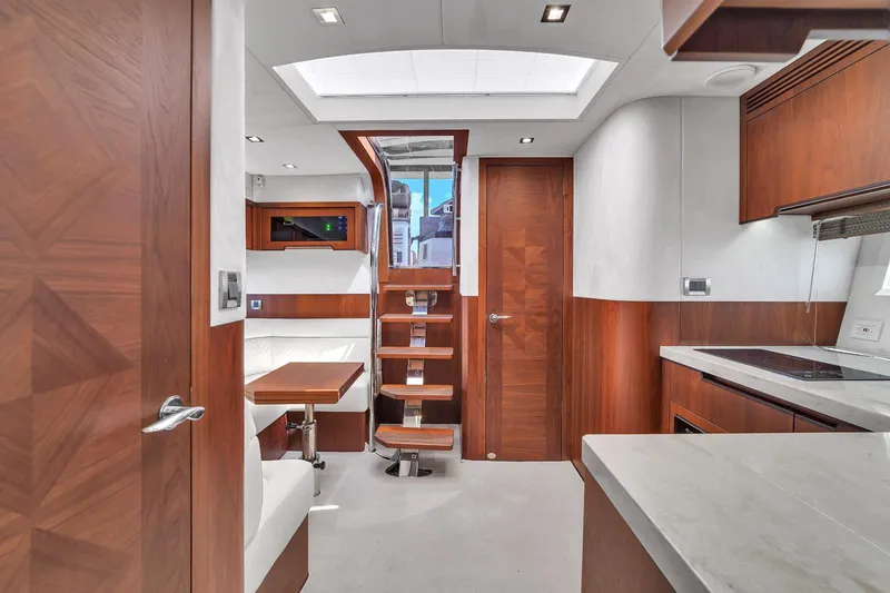 Slide: The Image of Interior of 2017 Galeon 445 HTS yacht with modern wood finishes and sleek design. - 17