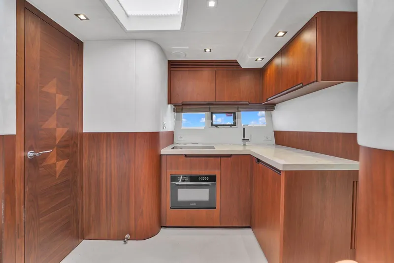 Slide: The Image of Modern kitchen interior of 2017 Galeon 445 HTS yacht with wooden cabinetry. - 22