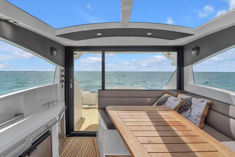 Slide: The Image of Interior of 2017 Galeon 445 HTS yacht with ocean view and modern seating area. - 6