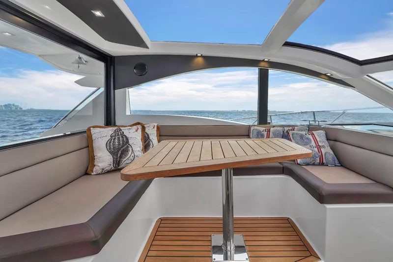 Slide: The Image of Interior of 2017 Galeon 445 HTS yacht with ocean view and cozy seating area. - 8