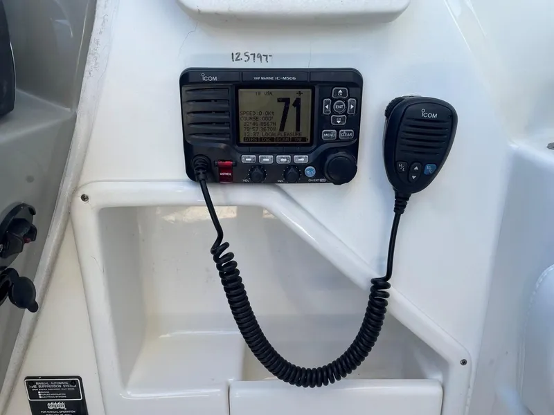 Slide: The Image of ICOM marine radio on 2015 Sea Ray 370 Venture boat. - 16