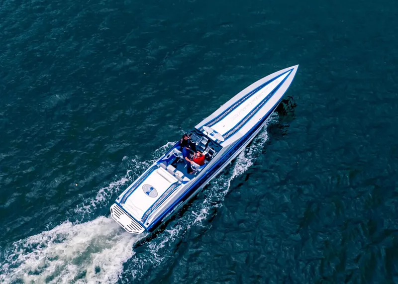 Slide: The Image of Aerial view of 2025 Cigarette 42X speedboat cruising on blue water. - 11