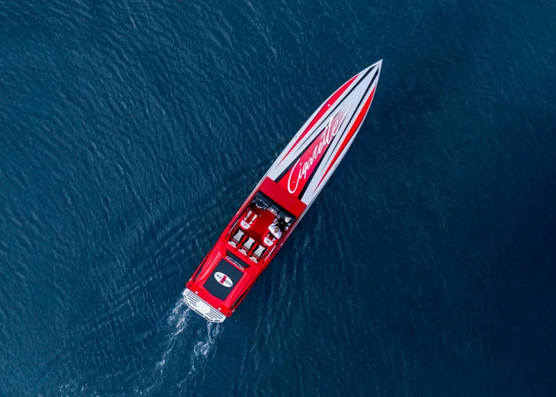 Slide: The Image of Aerial view of a 2025 Cigarette 42X speedboat cruising on blue water. - 12
