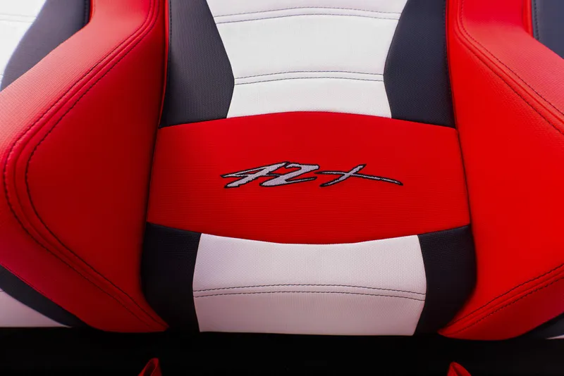 Slide: The Image of Red and white seat of 2025 Cigarette 42X boat with logo. - 14