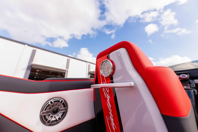 Slide: The Image of Interior of 2025 Cigarette 42X boat with red and white seating, speaker, and gauge. - 17
