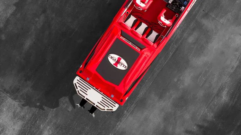 Slide: The Image of Top view of a 2025 Cigarette 42X speedboat in red. - 23