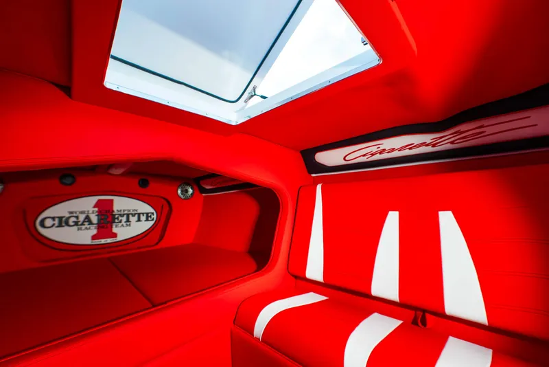 Slide: The Image of Interior of 2025 Cigarette 42X boat with red and white seating. - 27