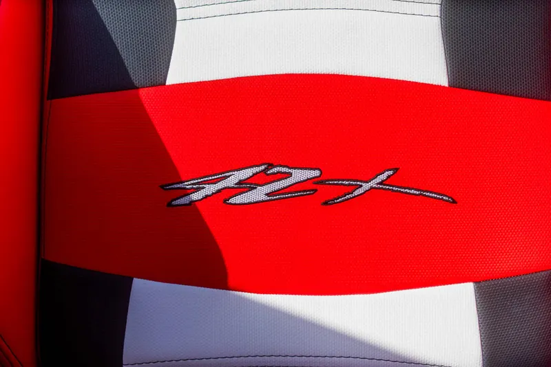 Slide: The Image of Cigarette 42X 2025 model logo on red and white upholstery. - 35