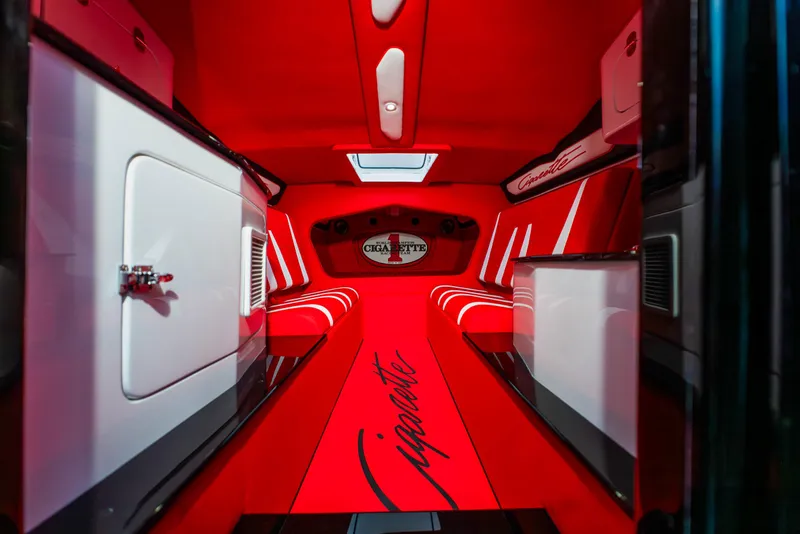 Slide: The Image of Interior of 2025 Cigarette 42X boat with red and white seating and sleek design. - 37