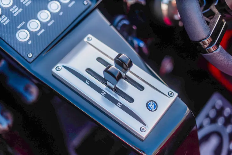 Slide: The Image of Cigarette 42X 2025 boat control panel with gear shift lever. - 42