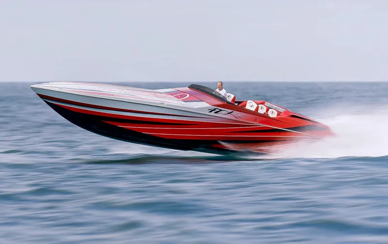 Slide: The Image of 2025 Cigarette 42X speedboat racing on open water. - 5