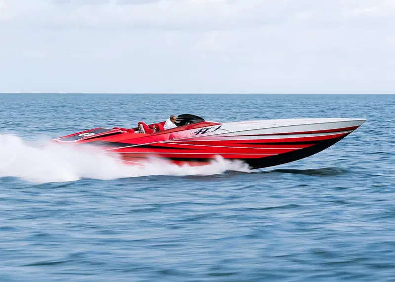 Slide: The Image of 2025 Cigarette 42X speedboat racing on open water. - 6