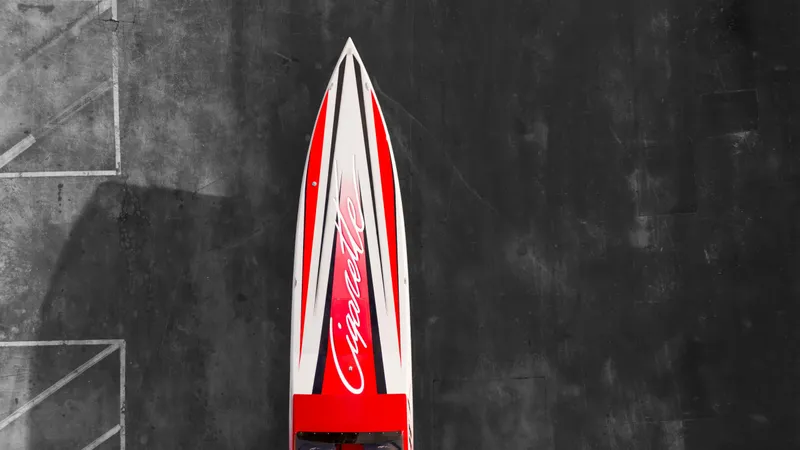 Slide: The Image of Top view of a 2025 Cigarette 42X speedboat with red and white design. - 8