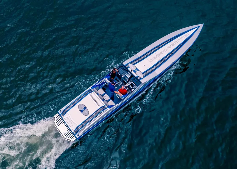 Slide: The Image of Aerial view of 2025 Cigarette 42X speedboat cruising on blue water. - 9