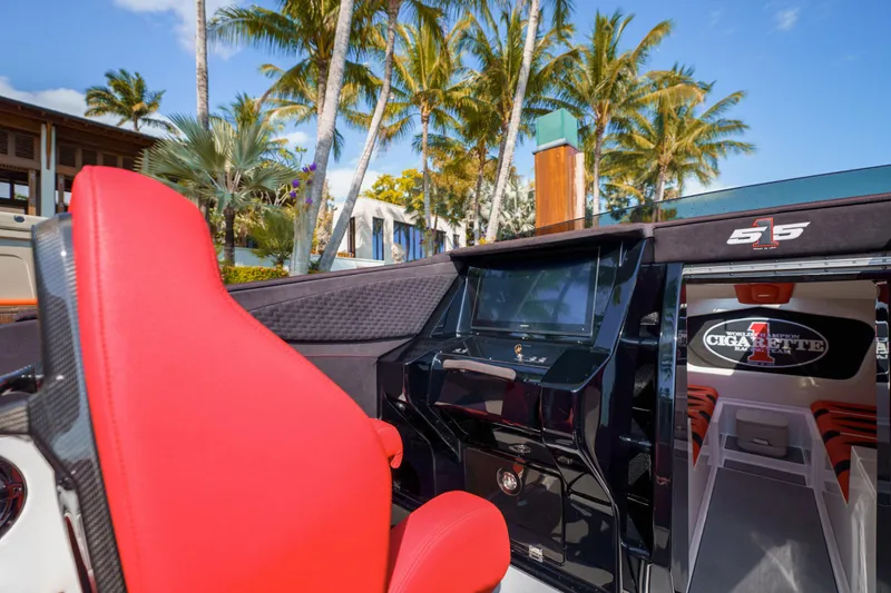 Slide: The Image of 2025 Cigarette 515 boat interior with red seat and modern dashboard. - 15