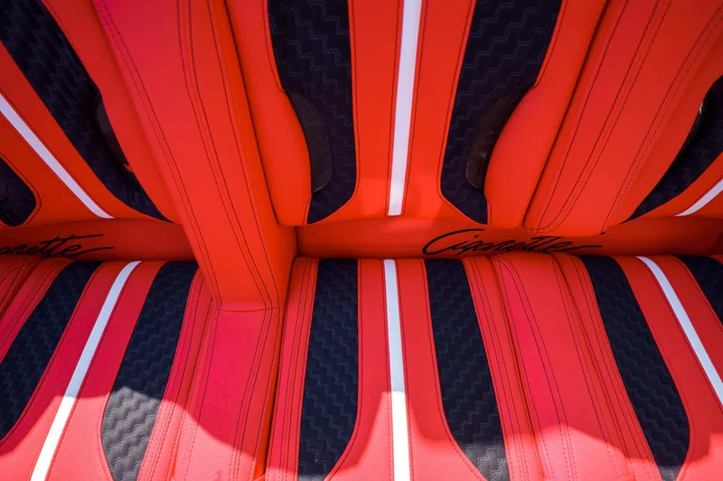 Slide: The Image of Red and black interior seats of 2025 Cigarette 515 boat. - 17