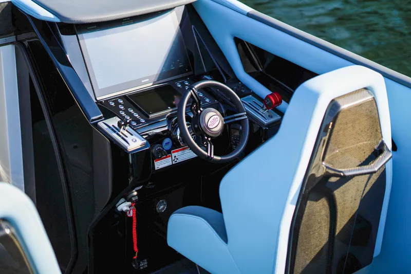 Slide: The Image of Modern cockpit of a 2025 Cigarette 515 boat with advanced controls and steering wheel. - 21
