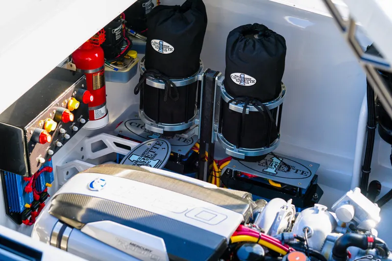 Slide: The Image of Engine compartment of a 2025 Cigarette 515 boat with advanced components and fire extinguisher. - 23
