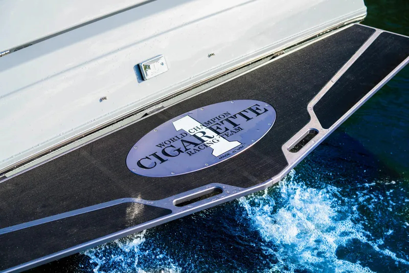 Slide: The Image of Cigarette 515 boat rear deck with logo, 2025 model, on water. - 24