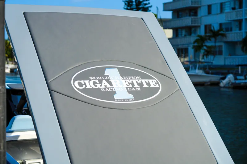 Slide: The Image of Cigarette 515 boat, 2025 model, World Champion Racing Team logo, docked near waterfront buildings. - 25