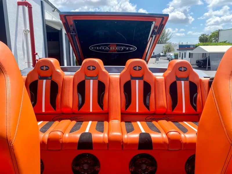 Slide: The Image of 2025 Cigarette 515 boat with vibrant orange and black seating. - 38