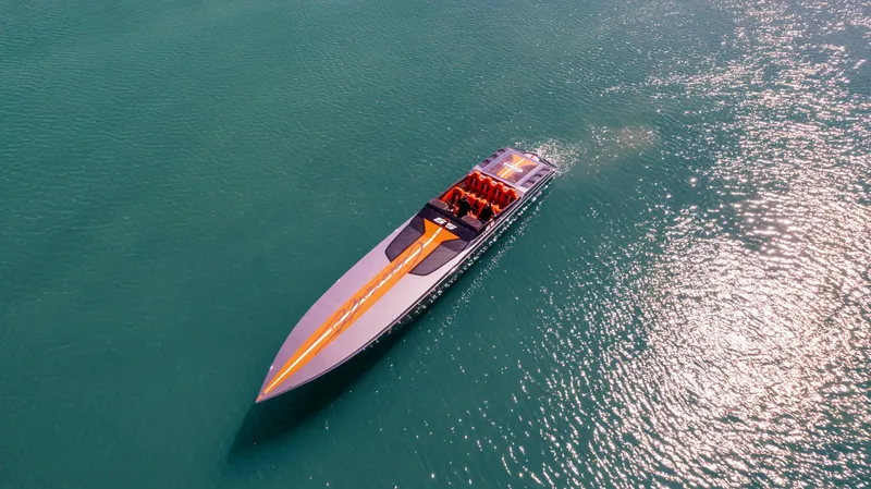 Slide: The Image of Aerial view of 2025 Cigarette 515 speedboat on turquoise water. - 40