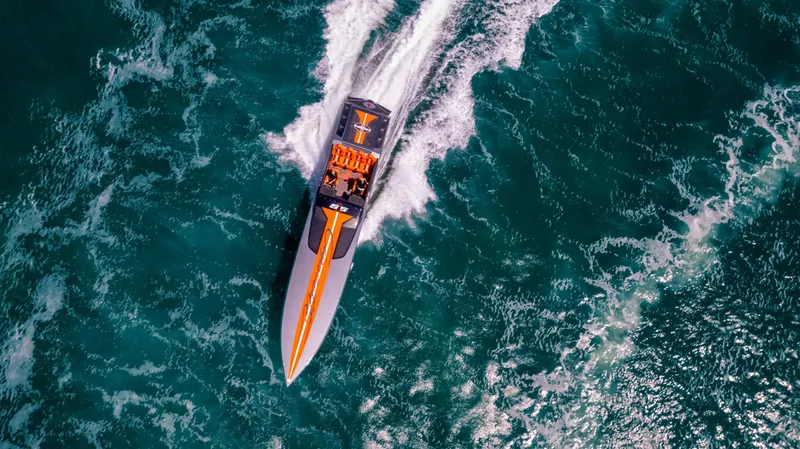 Slide: The Image of Aerial view of 2025 Cigarette 515 speedboat cruising on turquoise waters. - 44