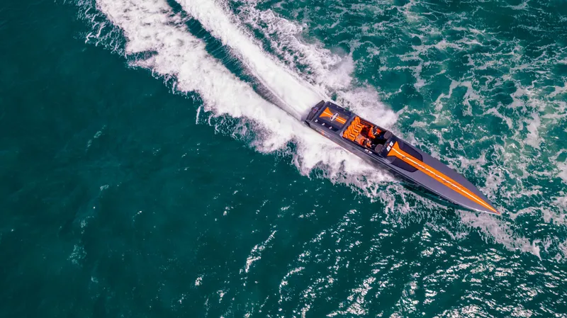 Slide: The Image of Aerial view of 2025 Cigarette 515 speedboat cruising on turquoise waters. - 45