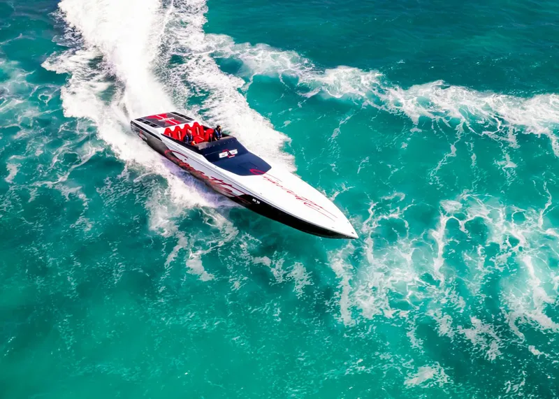 Slide: The Image of Cigarette 515 speedboat cruising on turquoise waters, 2025 model. - 6