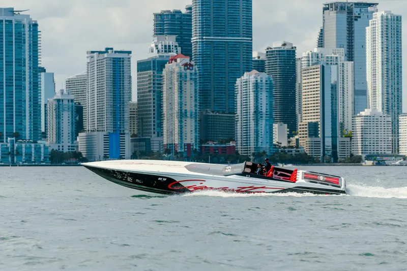 Slide: The Image of 2025 Cigarette 515 speedboat cruising near city skyline. - 8