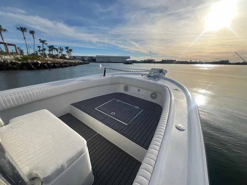 Slide: The Image of 2024 Deno 2400 CC boat on calm water at sunset. - 4