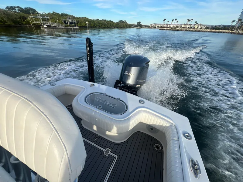 Slide: The Image of 2024 Deno 2400 CC boat cruising on a calm waterway. - 7