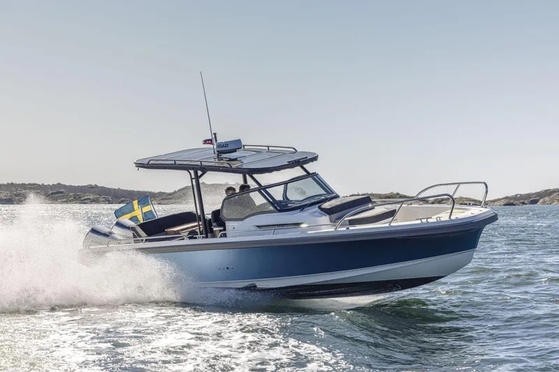 Slide: The Image of 2024 Nimbus T9 boat cruising on open water. - 8