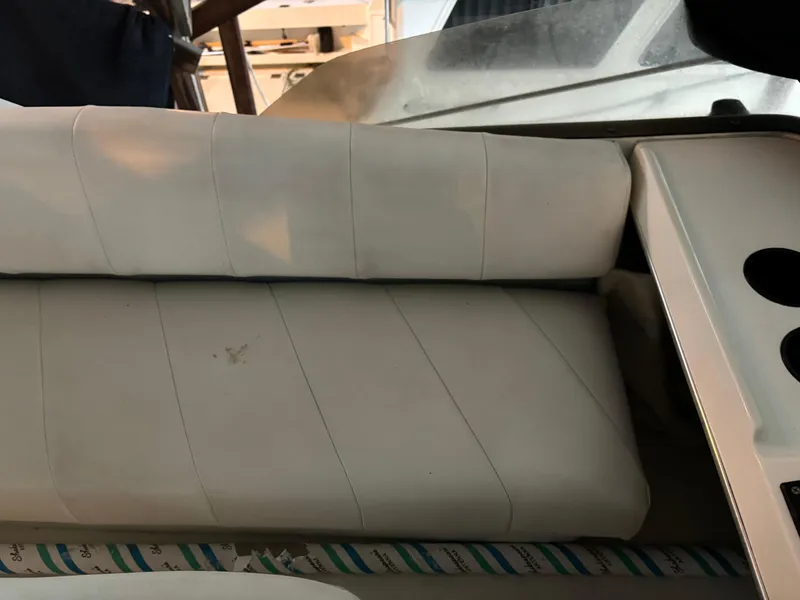 Slide: The Image of White cushioned seating on a 1992 Bayliner 3288 Motoryacht. - 12