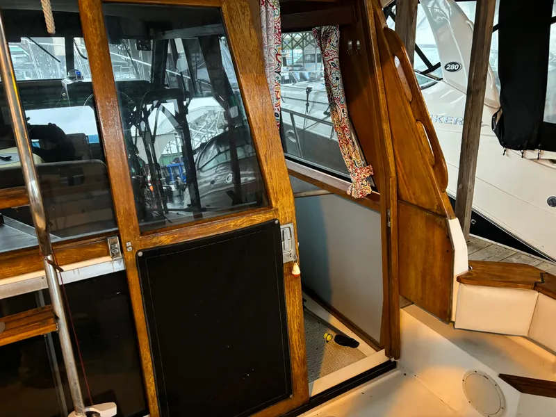 Slide: The Image of 1992 Bayliner 3288 Motoryacht interior with wooden doors and windows. - 2