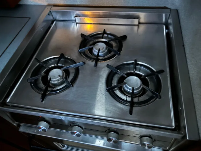 Slide: The Image of Stainless steel three-burner stove on 1992 Bayliner 3288 Motoryacht. - 24