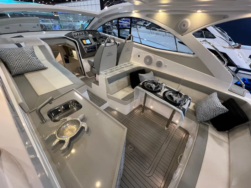 Slide: The Image of 2024 Evolve 360HT luxury yacht interior with modern seating and advanced navigation system. - 11