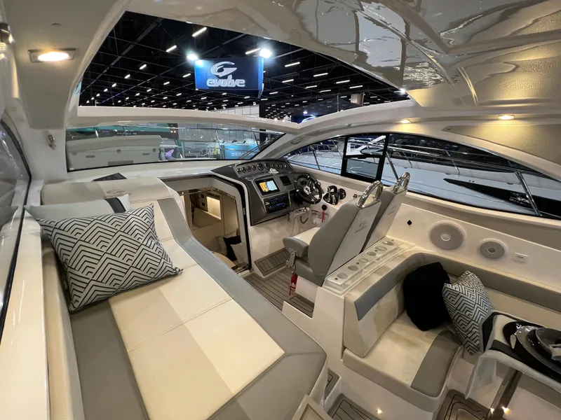Slide: The Image of Luxurious interior of the 2024 Evolve 360HT yacht with modern seating and helm. - 13