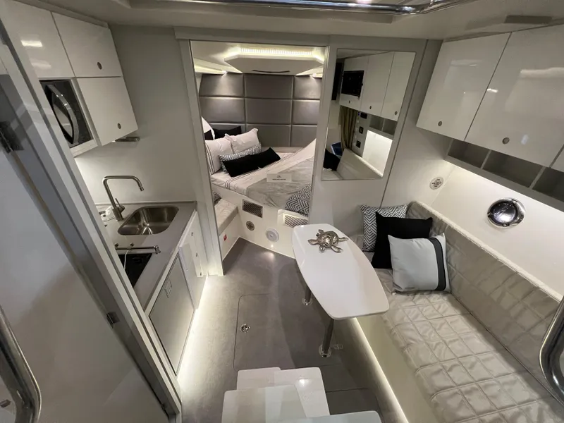 Slide: The Image of Luxurious interior of 2024 Evolve 360HT yacht with modern kitchen, cozy seating, and elegant bedroom. - 17